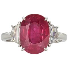 An elegant Ruby ring. 5.33 carat GIA certified Ruby set with special cut white side diamonds weighing 0.66 carats. Set in platinum. Ruby And Diamond Ring, Platinum Diamond Rings, Oval Engagement, Ruby Jewelry, Engagement Rings Oval, Christmas Books, Ruby Diamond, Three Stone Rings, Ruby Ring