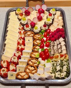 a platter filled with lots of different types of cheeses and crackers on it