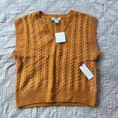 New With Tags Golden Orange Color Very Soft Size Xs But Seems Like It's A Bit Of An Oversized Fit Great Transitional Piece For Spring & Fall Fall Yellow Cable Knit Top, Yellow Cable Knit Top For Fall, Sleeveless Yellow Sweater Vest For Fall, Casual Yellow Knit Sweater Vest, Casual Yellow Cotton Sweater Vest, Casual Yellow Sweater Vest For Winter, Casual Yellow Sweater Vest For Fall, Yellow Sleeveless Top For Fall, Casual Yellow Sweater Vest For Summer