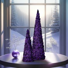 two purple trees sitting on top of a table