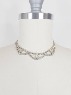 1950s rhinestone and mesh choker ~Gold tone metal mesh ~Prong set rhinestones ~Hook closure Condition: Excellent Length: 13.5-16.5" Bib piece meadures 4.5" x 5/8" Chain width: .25" Message us with any questions! Sarah Vogt Vintage Rhinestone Choker For Party, 50s Jewelry 1950s Necklaces, Vintage Gold Rhinestone Necklace, Gold Vintage Rhinestone Necklace, 1950s Jewelry Rhinestone, Evening Necklace, Rhinestone Choker, Metal Mesh, Wedding Jewellery Necklace