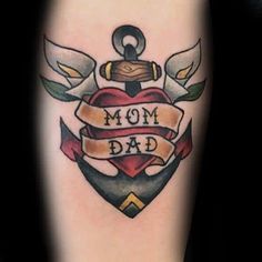 a tattoo with an anchor, heart and ribbon that says'mom dad'on it