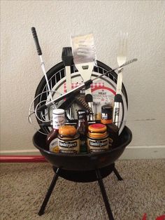 a barbecue grill with bbq tools and condiments