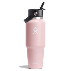 a pink water bottle with a black lid and a white logo on the side that says hydro flask