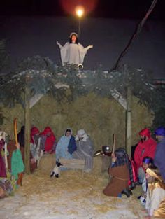 a nativity scene with people dressed in costumes