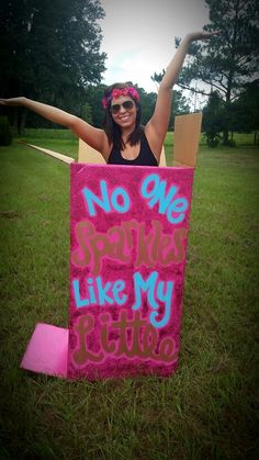 a woman is holding up a sign that says no one stands like my sister