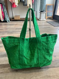 This extra large green tote bag is a spacious and stylish accessory that exudes fun and relaxation. The vibrant green color will add a pop of color to any outfit. Withe textured cloth, this piece will guarantee visual interest to any look. This tote is designed to be practical and functional, with ample room for all your essentials. Trendy Green Large Capacity Canvas Bag, Trendy Green Canvas Bag With Large Capacity, Green Canvas Bag With Large Capacity And Double Handle, Green Canvas Bag With Double Handle And Large Capacity, Trendy Green Large Capacity Bag, Trendy Large Capacity Green Bag, Green Crochet Shoulder Bag For Spring, Spring Green Crochet Shoulder Bag, Casual Dark Green Bag For Daily Use