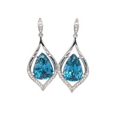 These beautiful drop earrings feature a pair of 17.94 carat weight Blue Zircon gemstones with natural earth mined diamonds set in solid 14K gold. These Blue Zircon earrings make a lovely December birthstone gift for your loved ones! These earrings are made with solid 14k Gold and natural earth mined SI / G-H Diamonds. As listed, these earrings are ready to ship. If you're interested in purchasing this setting with a different center stone please message us! Luxury Pear-shaped Blue Topaz Jewelry, Blue Pear-shaped Cubic Zirconia Jewelry, Blue Pear-shaped Cubic Zirconia Necklace, Luxury Blue Topaz Teardrop Earrings, Luxury Blue Topaz Drop Earrings, Designer Silver Jewellery, Jewelry Showcases, Birthstone Gifts, December Birthstone