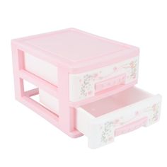 two pink drawers with flowers painted on the sides and one drawer open to show what's inside