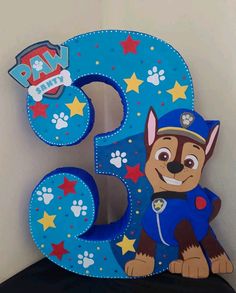 the number three is made to look like a cartoon dog with paw patrol on it