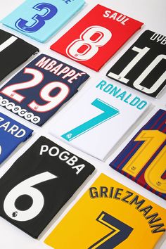 many different soccer jerseys are displayed on a white surface with the number seven in each