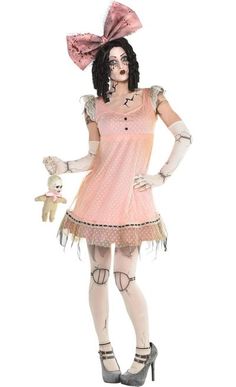 a woman in a pink dress and white tights is holding a stuffed animal while standing with her hands on her hips