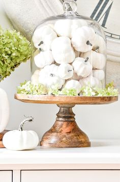 a cake covered in white marshmallows sitting on top of a table