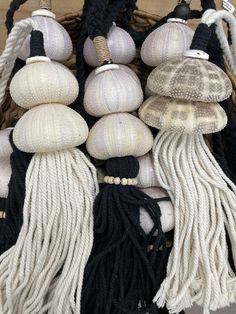 a basket filled with lots of different types of hats and tassels on top of each other