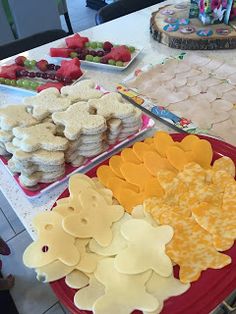 there are many desserts on the table ready to be cut and served for consumption