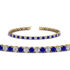 two pieces of blue and white stones in gold tone tennis bracelets with diamonds on each side