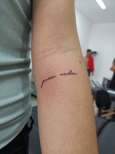 a person with a tattoo on their arm