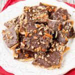 a white plate topped with chocolate and nuts