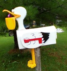 a mailbox with a painted duck on it