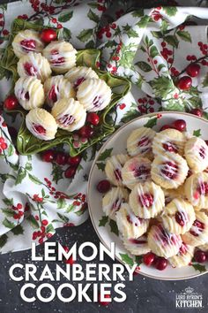 lemon cranberry cookies on a plate next to a bowl of cranberries