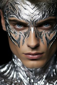 a man with silver paint on his face