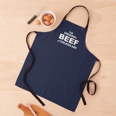 an apron that says the original beef and chardalian on it next to some eggs