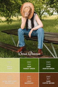 a woman sitting on top of a wooden bench wearing a straw hat and blue jeans