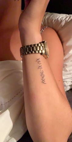 a woman with a gold bracelet on her arm and the words, my mom is mine