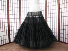 "The pictured petticoat was a custom order for a bride. The reason for the white top is so that the dark color does not cast a shadow underneath the fitted torso of a white or ivory gown. The design of this petticoat is so that the most fullness is at the hem of the skirt with little to no added fullness in the hip area. This sale is for a custom version of the pictured black and white single layer petticoat made out of soft nylon chiffon. The waist will be .75\" (2cm) wide elastic that will be Ivory Gown, Fashion 1950s, Black Floor, White Chiffon, Dark Color, Polyester Satin, 1950s Fashion, Petticoat, White Tops