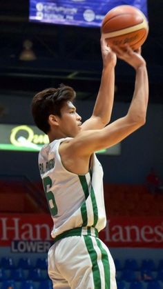 a basketball player is getting ready to dunk the ball