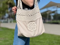 🏖️ Get ready for the beach or shopping with this stylish and durable fabric knitted bag! Perfect for carrying your essentials, this bag is made from high-quality fabric that can withstand the rigors of daily use. The knitted design adds a touch of elegance, making it the perfect accessory for any outfit. With plenty of space and a sturdy construction, this bag is both practical and fashionable. Whether you're hitting the beach or running errands, this bag has you covered in style! Casual Crochet Beach Bag, Cream Cotton Shoulder Bag For Summer, Cotton Shoulder Bag For Daily Use At Beach Season, Cream Cotton Beach Bag For Vacation, Beach Cotton Shoulder Bag With Adjustable Strap, Casual Crochet Beach Bag For Daily Use, Cotton Shoulder Bag For Everyday Beach Use, Beach Canvas Bag With Adjustable Strap, Beige Cotton Bag For Beach Season