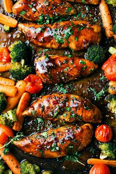 chicken, carrots and broccoli in a pan with sauce on top for garnish