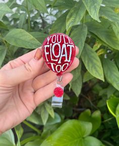 Holographic silver lettering with red glitter balloon. Inspired by Pennywise's red balloon.  The acrylic piece measures 2 inches in height.  All badge reels are 100% customizable, which includes glitter colors, vinyl colors, names and/or short phrases.  All badge reels are handmade and may contain small flaws including, but not limited to, minor bumps, bubbles, and/or misplaced glitter.  Colors of the actual item may vary to what is shown on the screen due to differences in digital devices.  I do my best to reach as close to perfection as possible before the item is shipped to you. All items are made to order in the sequence that I receive them.  My current turn around time for badge reels is 3-4 weeks before shipping.  If this time frame does not work, please message me and I will do my b Customizable Red Badge Reel As A Gift, You'll Float Too, Glitter Balloons, Red Balloon, Nurse Badge Reel, Red Glitter, Vinyl Colors, Badge Holders Lanyard, Badge Reel