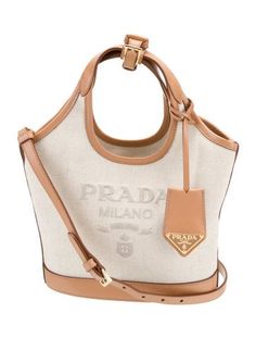 Prada Bucket BagFrom the 2024 CollectionNaturale Vitello LeatherGraphic PrintGold-Tone HardwareLeather TrimCutout Handles & Single Adjustable Shoulder StrapLeather Trim EmbellishmentCanvas Lining & Single Interior PocketOpen TopIncludes Clochette Leather Bucket Bag, Leather Bucket, Bucket Bag, Print Patterns, Prada, Women Handbags, Handles, Trim, Handbags