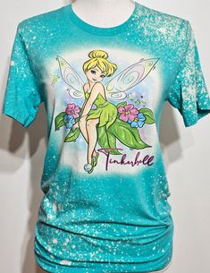 a blue shirt with a green tinkerbell on it