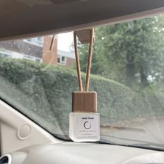 an air freshener hanging from the dash of a car