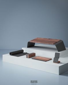 three pieces of furniture sitting on top of each other in front of a gray background