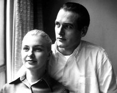 a black and white photo of a man and woman