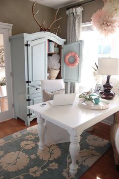 a living room with a white table and chairs