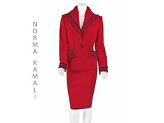 It's been quite a while since I've seem a great vintage garment from Norma Kamali, but it was worth the wait! This exquisite 1980s red suit is 100% wool bedecked with black soutache and braid trimming the collar, lapels, pocket flaps, and cuffs. It's hard to see in the photos, but the fabric is woven with a window pane pattern and twill stripes. The shawl collar is padded and gathered at the back of the neck, creating a flattering, face-framing shape. The jacket also has substantial shoulder pad Vintage Suit, Womens Suits, Vintage Suits, Red Suit, Worth The Wait, Window Pane, Norma Kamali, Wool Suit, Face Framing