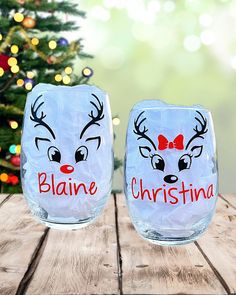 two wine glasses decorated with reindeer faces and the words blance, christmas written on them