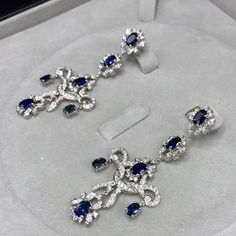 ENJOY OUR WORRY-FREE SERVICE AND THE DAZZLING, GENUINE JEWELRY WE DESIGN AND HANDCRAFT WITH LOVE❤️ ABOUT THE ITEM: A true MASTERPIECE, CHANDELIER EARRINGS, FEATURING 12 PIECES OF TOP GRADE, VIVID BLUE, FULLY TRANSPARENT, SIAMESE BLUE SAPPHIRES, weighting a total of 10.42 carats & over 232 pieces of E/VS DIAMONDS. With total diamonds weight at a WHOOPING 2.61 carats!! Set in ONE OF A KIND 18K SOLID WHITE GOLD, ENORMOUS CHANDELIER EARRINGS! (18 grams of gold weight) WORLD-CLASS MASTERPIECE NOW Luxury Blue Chandelier Earrings For Formal Occasions, Luxury Sapphire Diamond Earrings, Luxury Oval Sapphire Diamond Earrings, Luxury Sapphire Diamond Earrings With Brilliant Cut, Luxury Blue Diamond Drop Earrings, Luxury White Gold Sapphire Diamond Earrings, Luxury Blue Diamond Earrings With Prong Setting, Luxury Sapphire Earrings, Luxury Blue Diamond Earrings With Accents