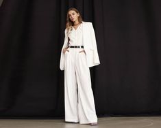 White Palazzo Pants, Bridal Suit, Wide Leg Trousers, Wedding White Suit, Formal Pants, Rehearsal Dinner, Engagement Suit, Woman Pants ⭐Size: Please write your chest, waist, hips, height, and we will make a suit to your individual measurements! After you place your order, we may ask you for additional measurements. We do this to ensure that the suit fits you perfectly👌😊 ⭐Our fabric: We have used a premium quality suiting fabric.  ⭐Shipping: ✈️We have two shipping options that we can offer: Free Shipping and Express Shipping. ✅ Free shipping takes about two weeks. ✅ Express shipping takes only 8-10 days. An extra fee of $35 should be paid for this option. When placing your order, please, keep in mind that it will take us 3 to 6 business days to tailor your suit. After that, the package wil Elegant Tailored White Wide Leg Pants, Elegant Formal Set With High-waisted Pants, Formal White Full-length Pants, Elegant Evening Sets With Wide-leg Pants, White Full Length Formal Pants, Elegant High-waisted Wedding Pants, White Full-length Formal Pants, Elegant Formal Sets With Wide-leg Pants, Elegant Tailored Sets With Wide-leg Pants