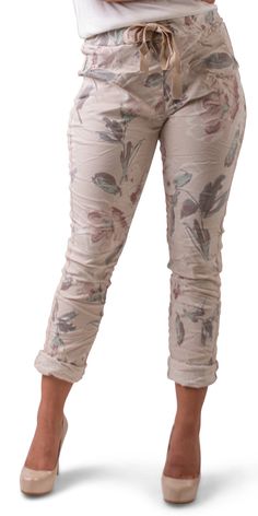 Lightweight Flower Print Pants With Tie Waist. Features a False Front Fly and Ribbon Side Stripes Down Each Leg. Two Front and Two Back Pockets. 95% Cotton, 5% Elastane Made in Italy One Size Model 5'7" Casual Floral Print Bottoms With Tapered Leg, Casual Tapered Leg Pants With Floral Print, Beige Floral Print Pants For Spring, Casual Floral Print Tapered Leg Pants, Casual Beige Pants With Floral Print, Casual Beige Floral Print Bottoms, Spring Beige Floral Print Pants, Spring Floral Print Beige Pants, White High-waisted Floral Print Pants