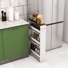 a kitchen with green cabinets and stainless steel refrigerator freezer next to the counter top