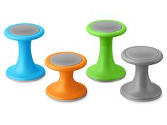 three different colored stools sitting next to each other