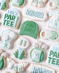 decorated cookies are arranged in the shape of golf related items, including hats and tees