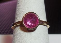 1.01ct Pink Sapphire Ceylon Rose Cut Bezel Set 14k Yellow Gold Handmade Alternative Engagement Ring Custom Made OOAK on Etsy, £393.03 Pink Sapphire Ring With Bezel Setting For Promise, Pink Oval Sapphire Ring With Bezel Setting, Pink Sapphire Bezel Ring, Gold Pink Sapphire Ring With Bezel Setting, 14k Gold Pink Sapphire Ring With Bezel Setting, Gold Engagement Ring Unique, Bezel Engagement Ring, Handmade Engagement Rings, Unique Engagement Ring