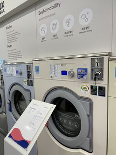 a washer and dryer are on display in a showroom with information about their functions