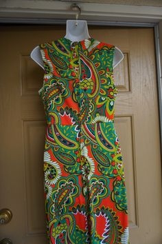 "Vintage 1970s maxi dress. No tags fits like a Medium. In good vintage condition. Please see measurements. Measurements taken across front laid flat - stretchy 19\" across front armpit to armpit 15\" across front of empire waist 24\" across hips 56\" length" 70s Inspired Fitted Maxi Dress, 1970s Fitted Green Maxi Dress, Fitted 1970s Style Green Maxi Dress, Green Fitted Maxi Dress 1970s Style, 1970s Fitted Sleeveless Maxi Dress, 1970s Style Fitted Green Maxi Dress, Retro Lined Maxi Dress, Retro Fitted Sleeveless Maxi Dress, Fitted Vintage Print Maxi Dress